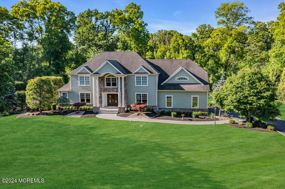 44 Meadowview Drive Colts Neck, NJ 07722 - Photo 68 of 68 a front view of a house with patio and garden