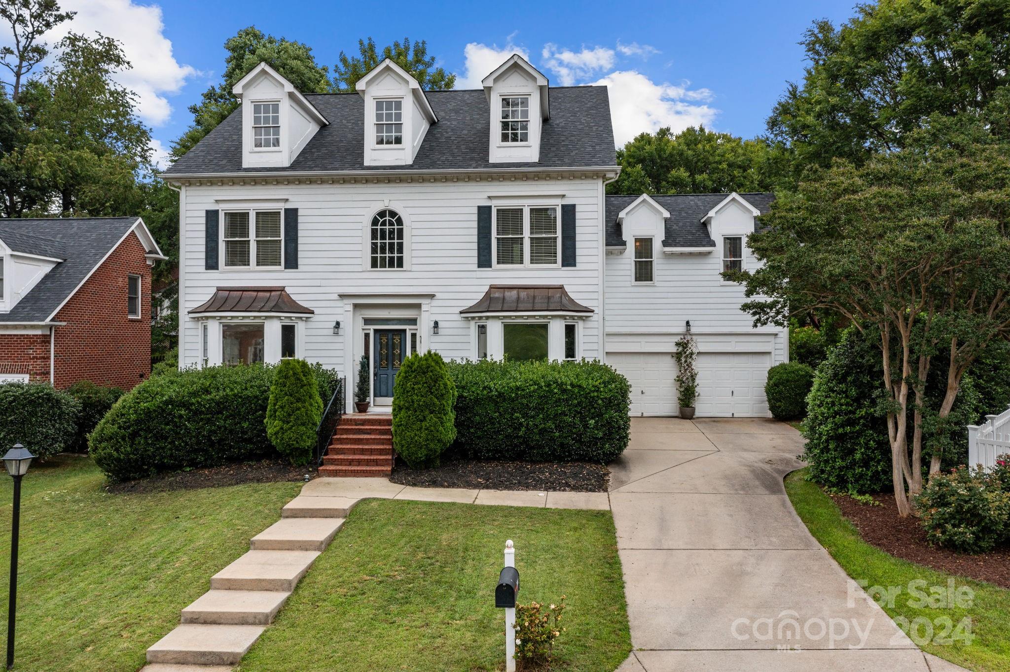 20443 Middletown Road Cornelius, NC 28031 - Photo 1 of 31 a front view of a house with a yard