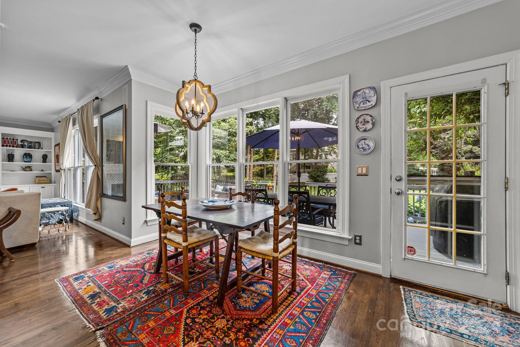 20443 Middletown Road Cornelius, NC 28031 - Photo 16 of 31 a view of a dining room with furniture window and wooden floor