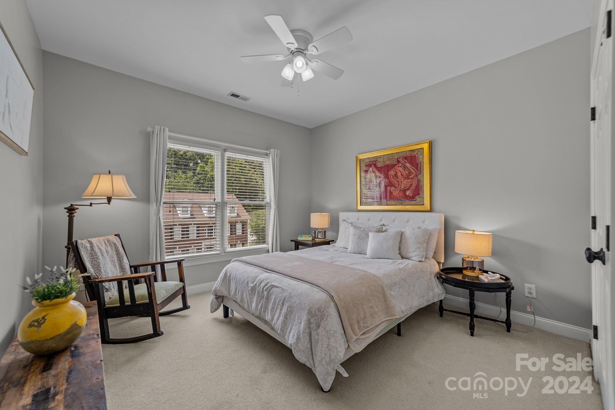 20443 Middletown Road Cornelius, NC 28031 - Photo 26 of 31 a bedroom with a bed a couch and a window