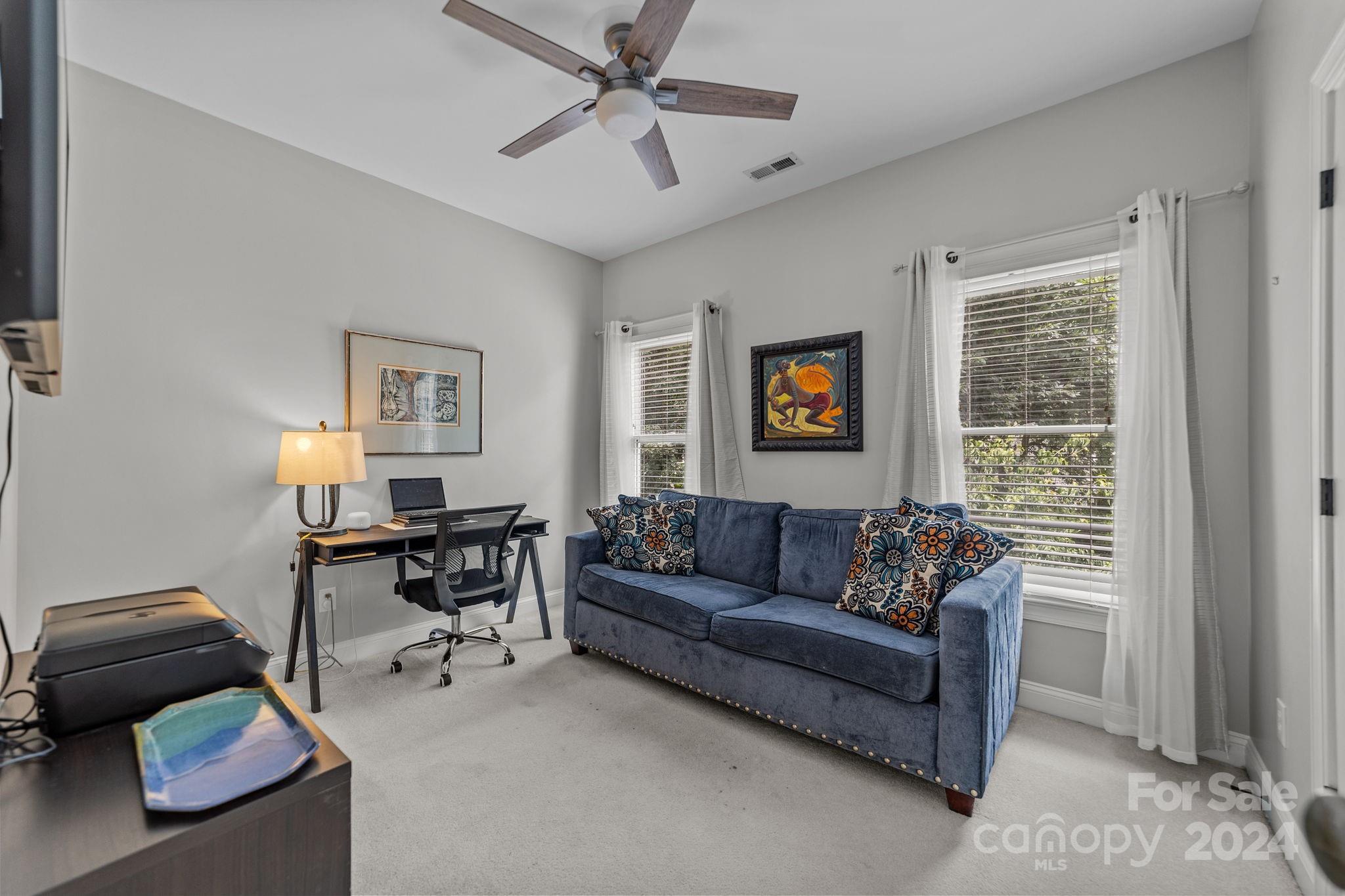 20443 Middletown Road Cornelius, NC 28031 - Photo 27 of 31 a living room with furniture and a window