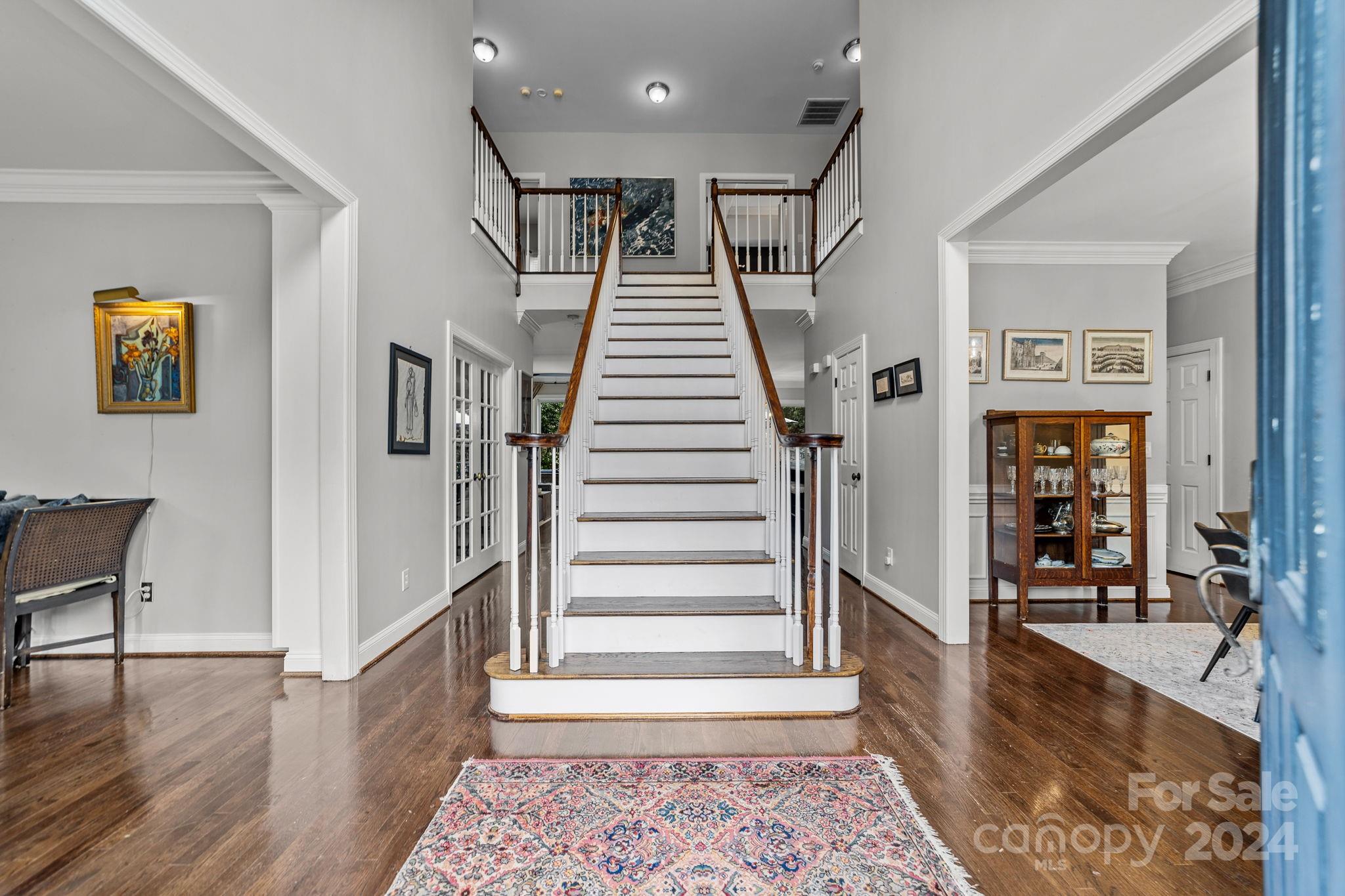 20443 Middletown Road Cornelius, NC 28031 - Photo 6 of 31 a view of entryway and hall with wooden floor