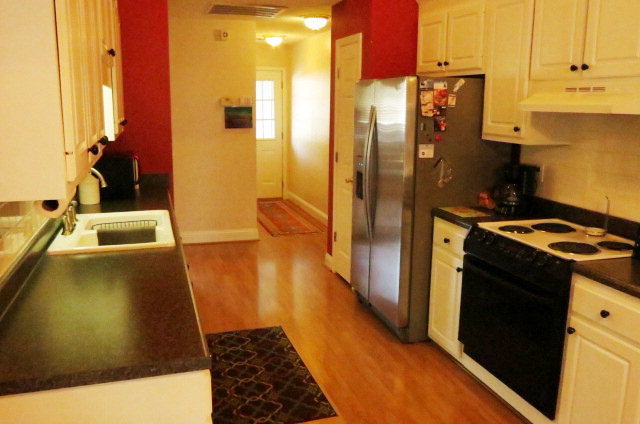 132 Deer Ridge Drive Lizella, GA 31052 - Photo 3 of 11 a kitchen with sink a refrigerator and a stove