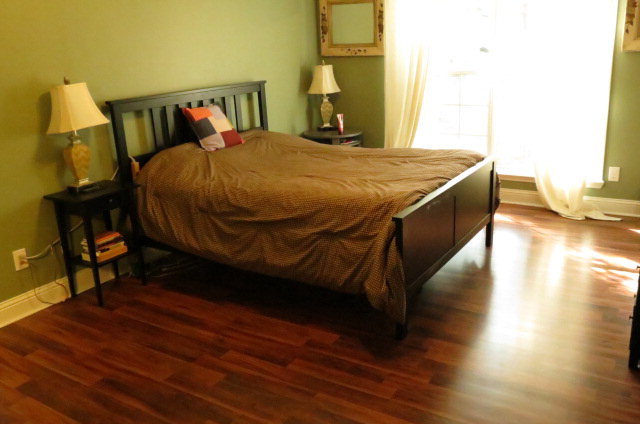 132 Deer Ridge Drive Lizella, GA 31052 - Photo 8 of 11 a bedroom with a bed and wooden floor