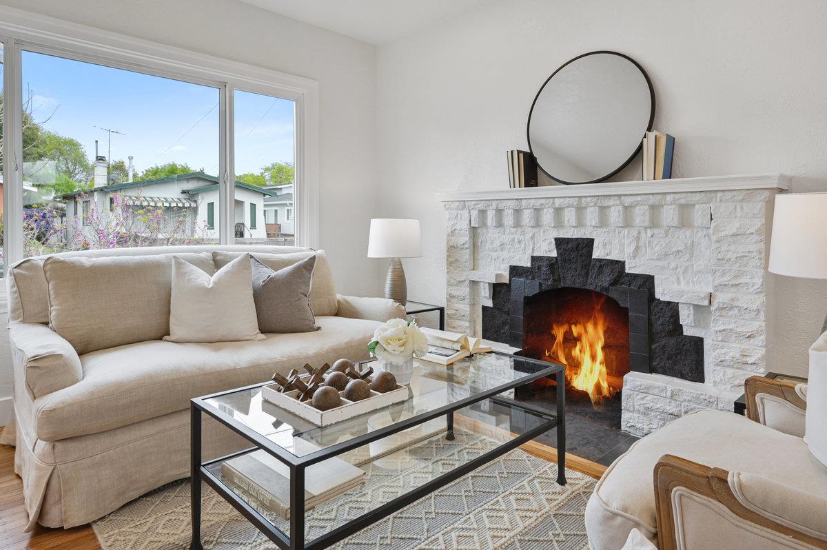 1333 67th Street Berkeley, CA 94702 - Photo 16 of 63 a living room with furniture a fireplace and window
