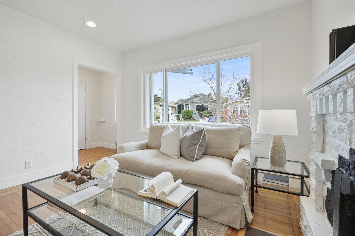 1333 67th Street Berkeley, CA 94702 - Photo 17 of 63 a living room with furniture and a window