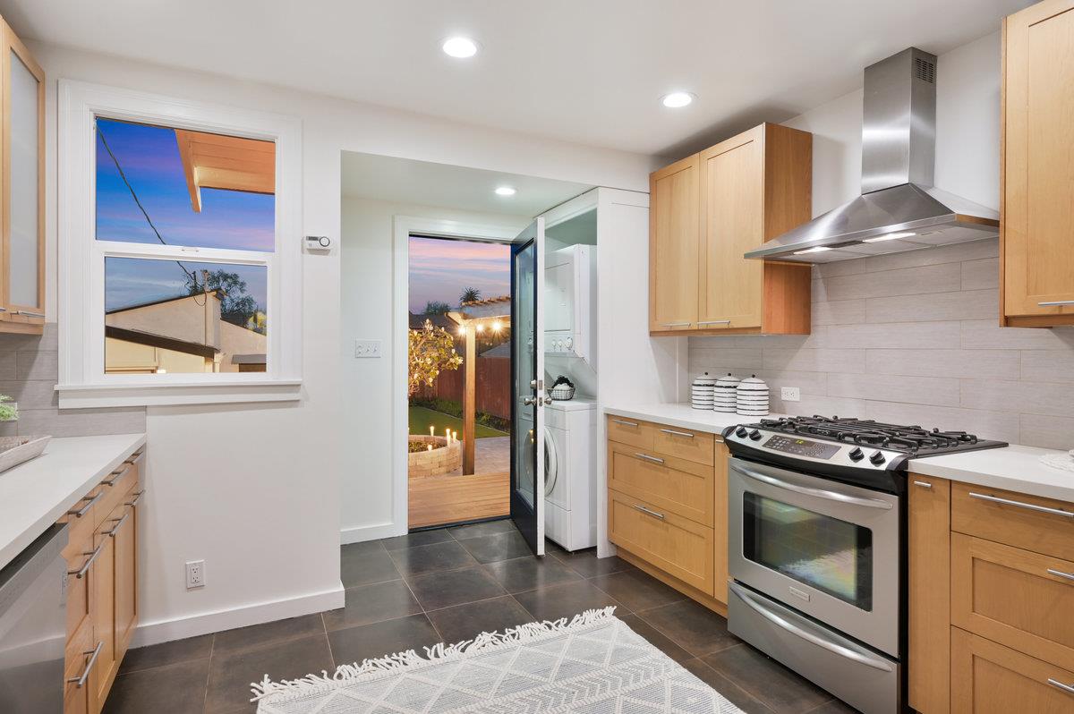 1333 67th Street Berkeley, CA 94702 - Photo 23 of 63 a kitchen with stainless steel appliances granite countertop a stove and a refrigerator