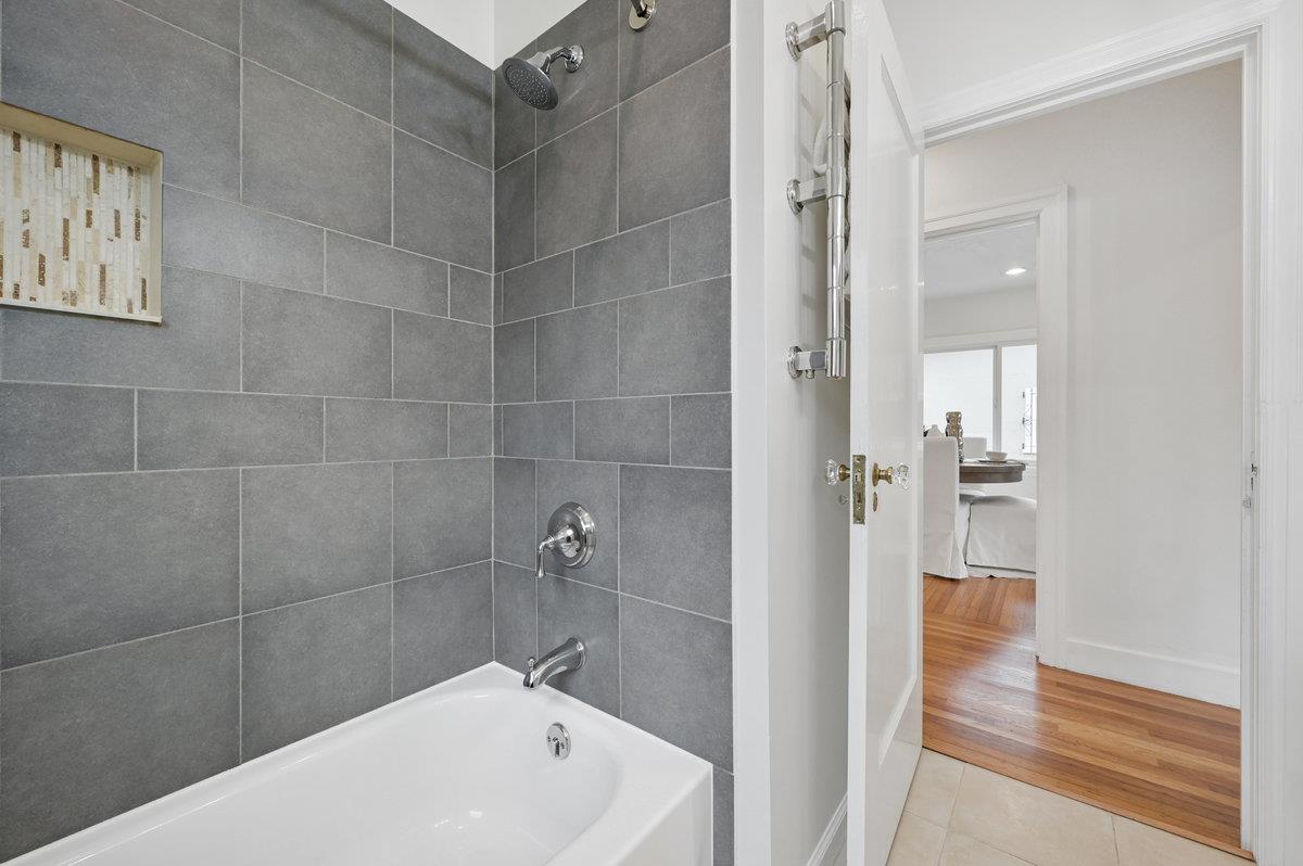 1333 67th Street Berkeley, CA 94702 - Photo 36 of 63 a bathroom with a bathtub and a shower