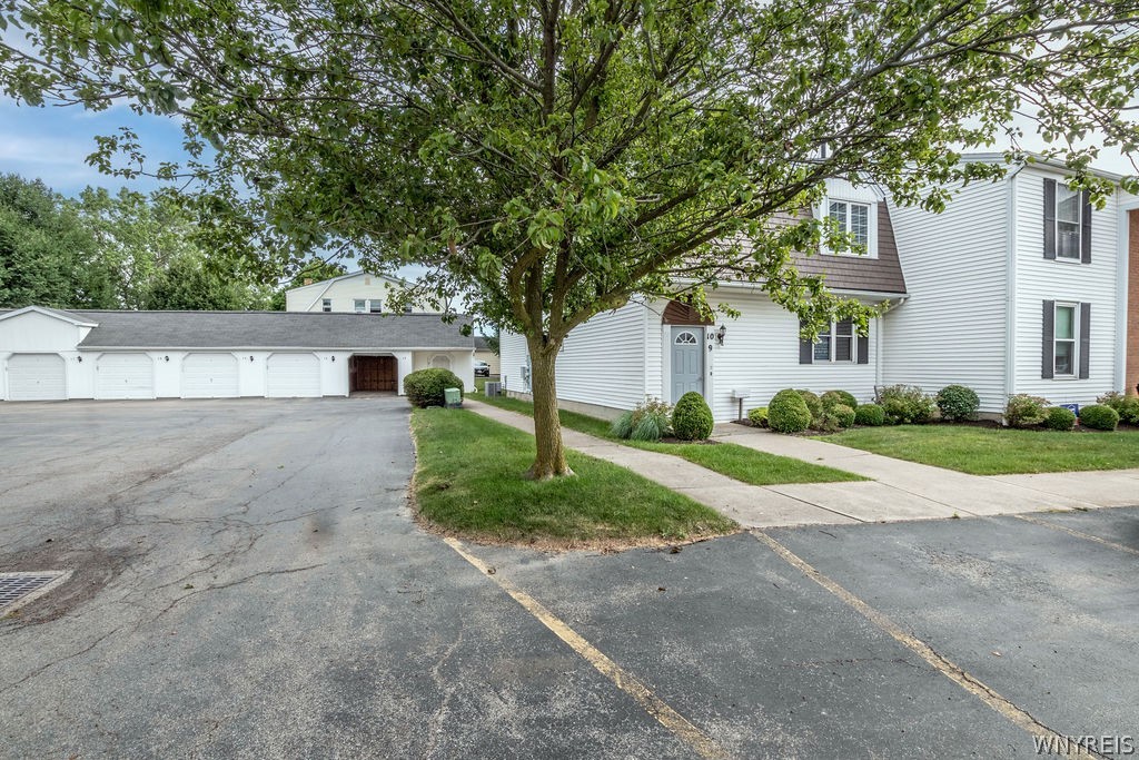 4755 Chestnut Ridge Road, Unit 9 Amherst, NY 14228 - Photo 5 of 46 The garage for this unit is the first open garage door. short walk from the front door and shorter walk from your rear deck.