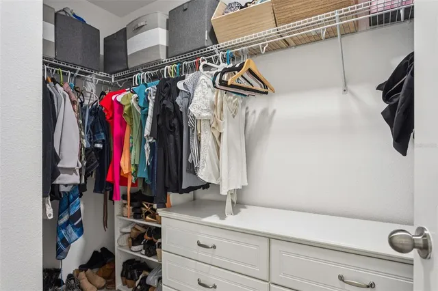 a view of a house with backyard and a garden