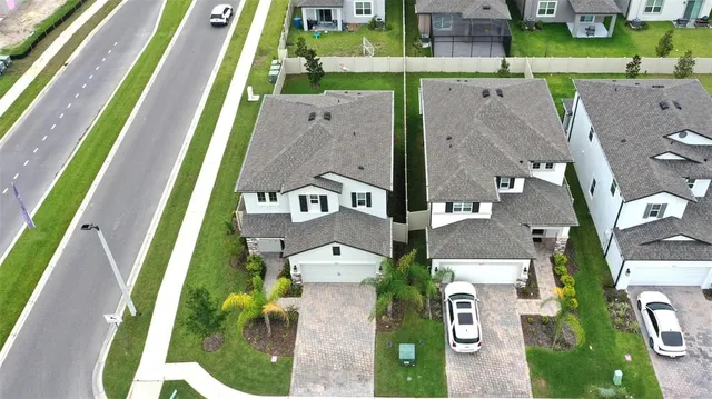 a view of backyard with swimming pool and outdoor seating