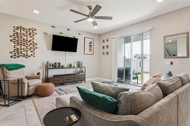 a kitchen with granite countertop white cabinets and stainless steel appliances