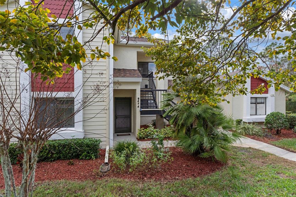 a view of a house with a tree