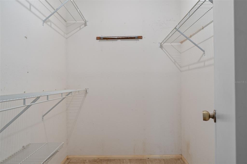 9474 Nakoma Way, Unit E Weeki Wachee, FL 34613 - Photo 20 of 31 a view of small space with racks on the wall