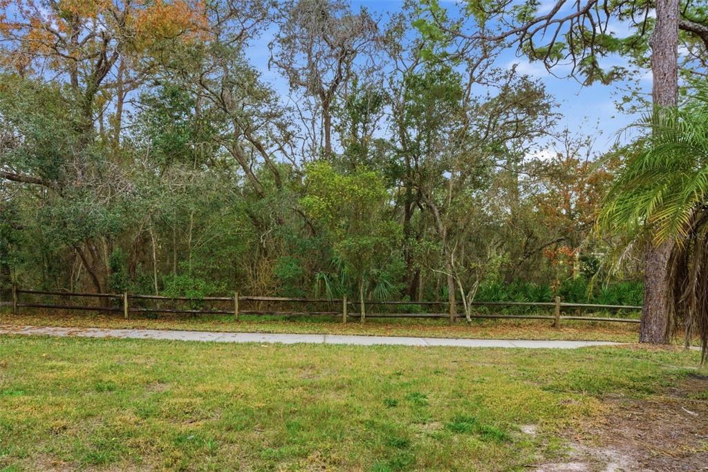 9474 Nakoma Way, Unit E Weeki Wachee, FL 34613 - Photo 29 of 31 a view of outdoor space with swimming pool