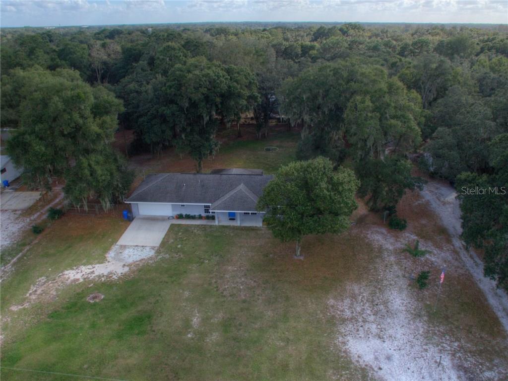3405 Swindell Road Plant City, FL 33565 - Photo 1 of 1 an aerial view of a house with a yard
