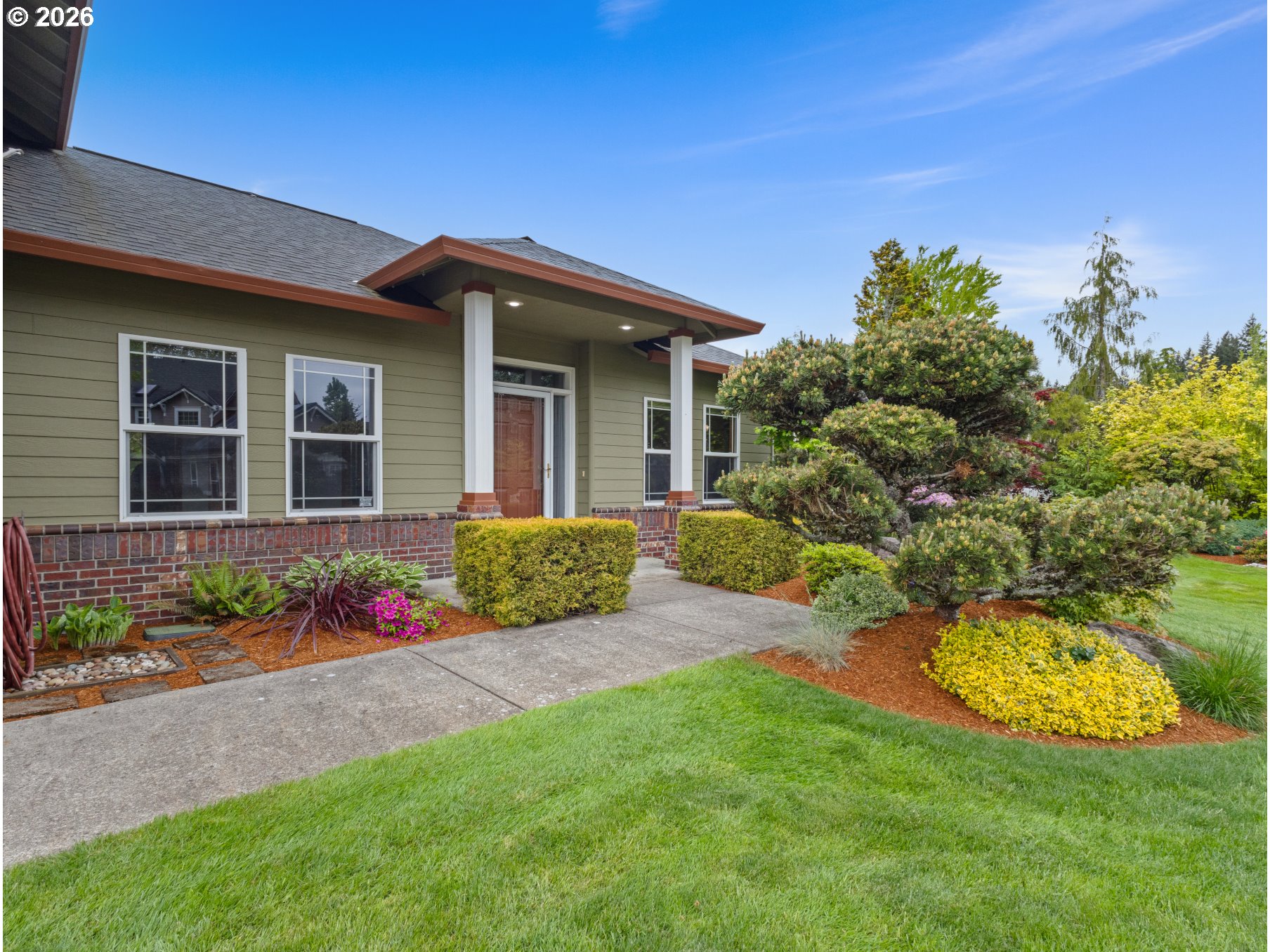 366 Southwest 37th Circle Gresham, OR 97080 - Photo 5 of 47 a front view of a house with a yard