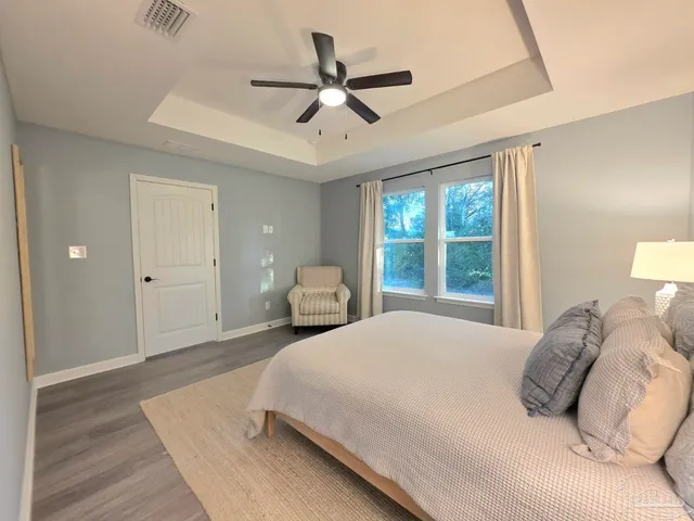 a bedroom with a bed and window