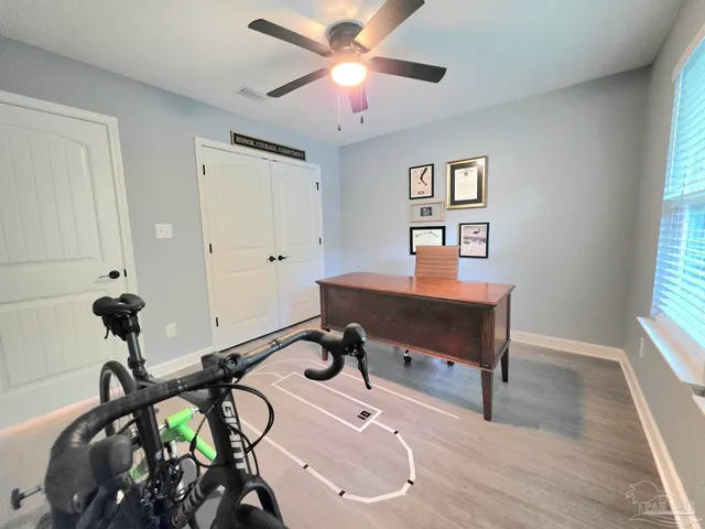 a room with gym equipment and a window