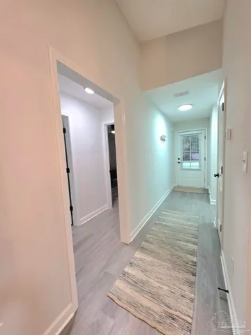 wooden floor with a bathroom