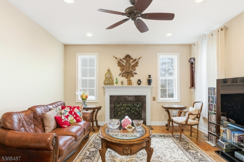 3 Marble Lane Randolph, NJ 07869 - Photo 12 of 46 a living room with furniture a fireplace and a flat screen tv