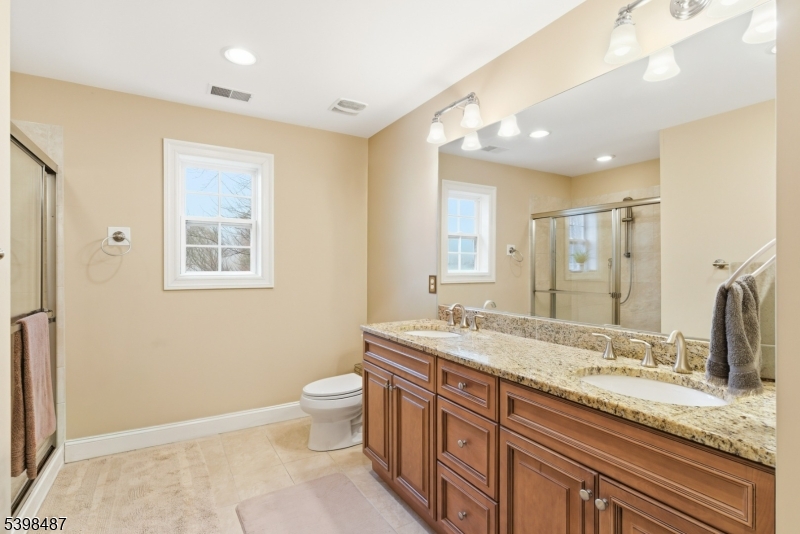3 Marble Lane Randolph, NJ 07869 - Photo 32 of 46 a bathroom with a granite countertop sink mirror vanity and toilet