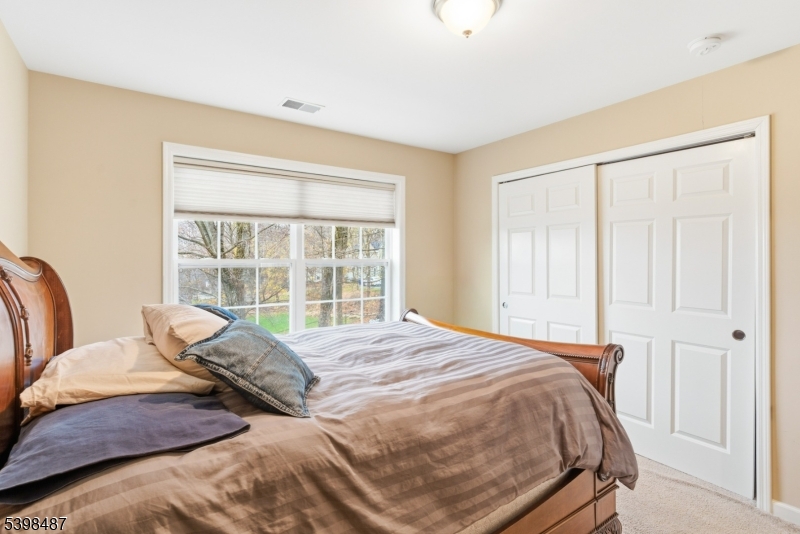3 Marble Lane Randolph, NJ 07869 - Photo 35 of 46 a large bed sitting in a bedroom next to a window