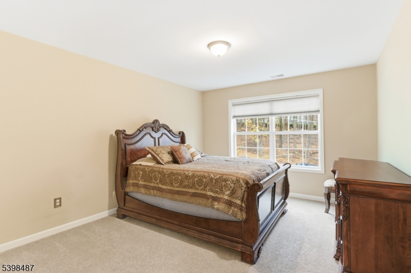 3 Marble Lane Randolph, NJ 07869 - Photo 40 of 46 a bed sitting in a bedroom next to a window