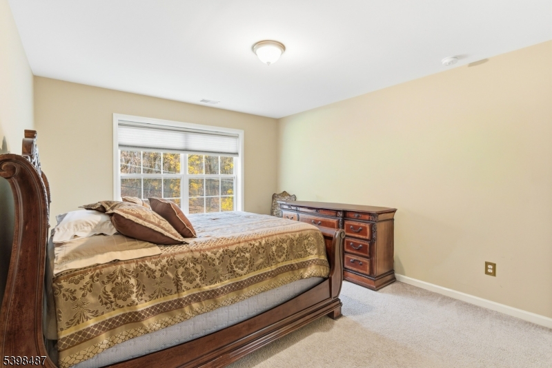 3 Marble Lane Randolph, NJ 07869 - Photo 41 of 46 a bed sitting in a bedroom next to a window