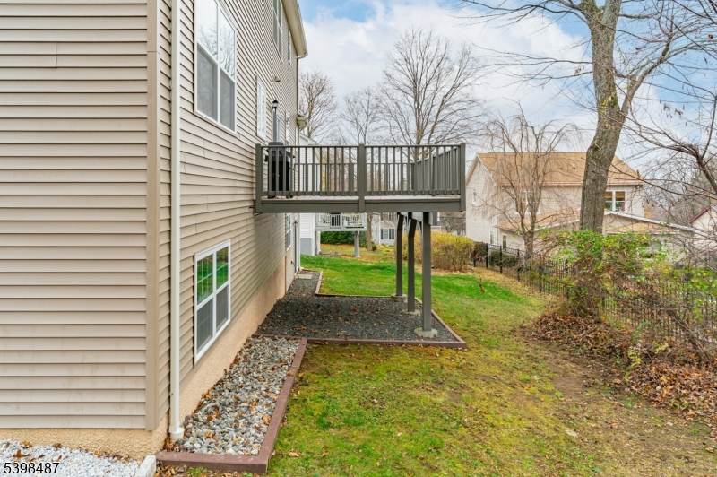 3 Marble Lane Randolph, NJ 07869 - Photo 7 of 46 a porch with a bench next to a yard