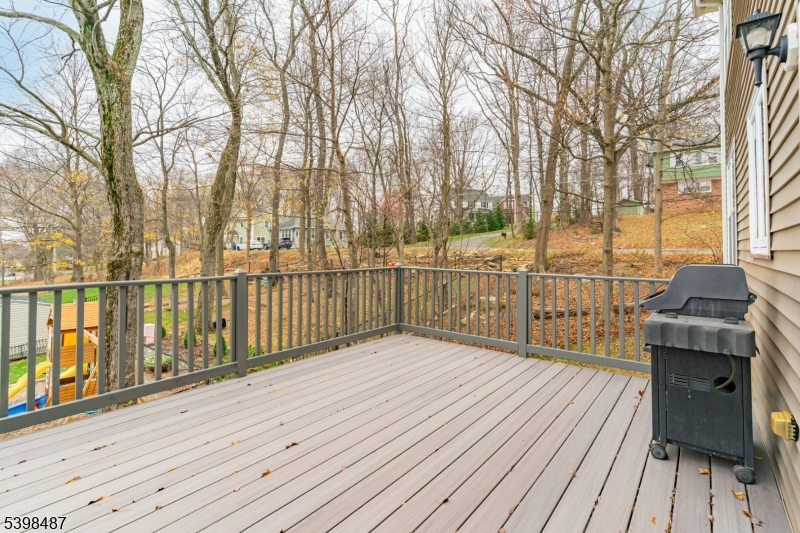3 Marble Lane Randolph, NJ 07869 - Photo 8 of 46 a view of a deck with wooden floor and fence next to a yard