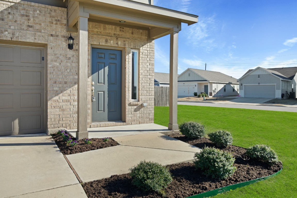 13005 Foreston Drive Austin, TX 78754 - Photo 1 of 36 a front view of a house with garden