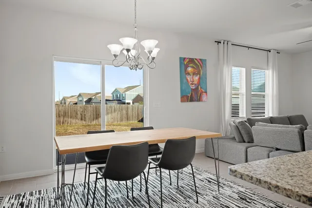 a very nice looking dining room with a table and chairs