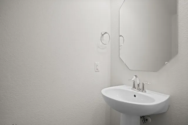 a kitchen with stainless steel appliances granite countertop a sink refrigerator and microwave