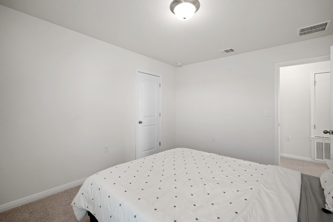 13005 Foreston Drive Austin, TX 78754 - Photo 26 of 36 a bedroom with a bed and a window