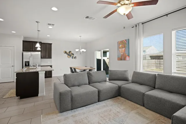 a living room with a couch and a flat screen tv
