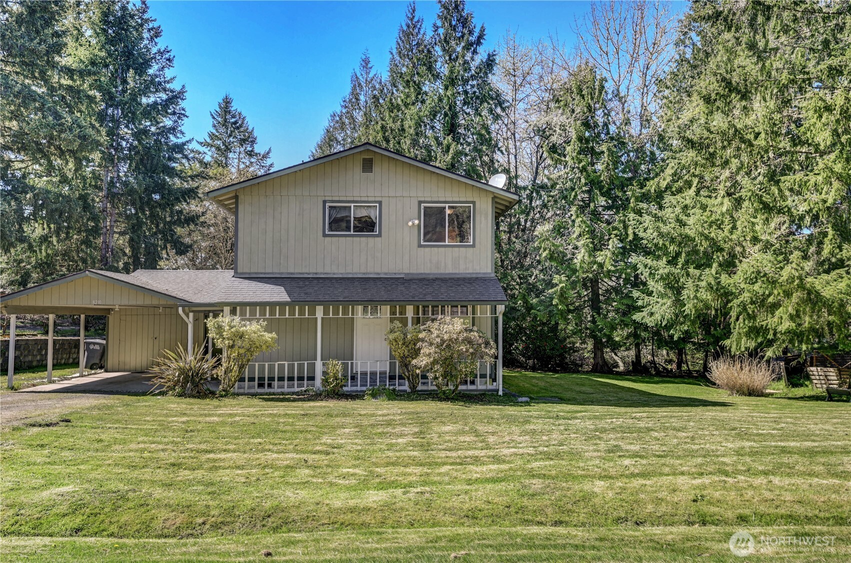 8210 176th Avenue Southwest Longbranch, WA 98351 - Photo 1 of 28 a front view of a house with garden