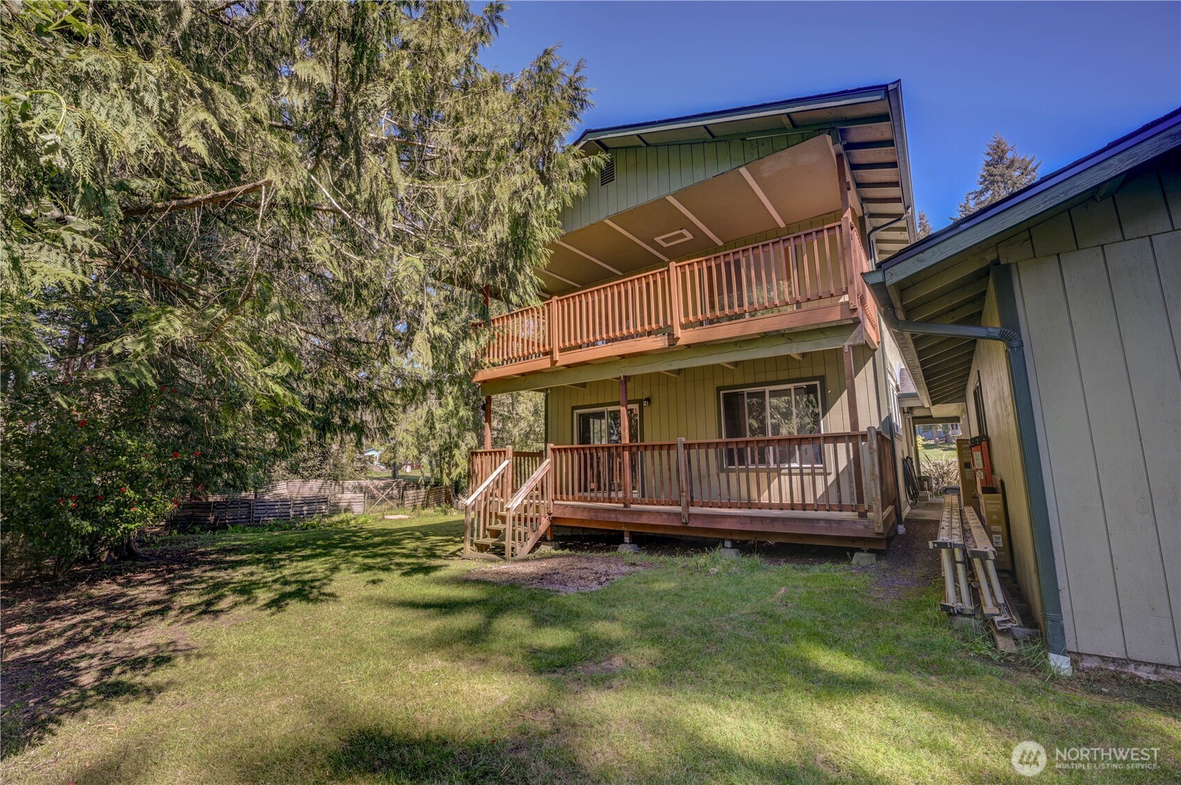 8210 176th Avenue Southwest Longbranch, WA 98351 - Photo 21 of 28 a view of a house with a yard