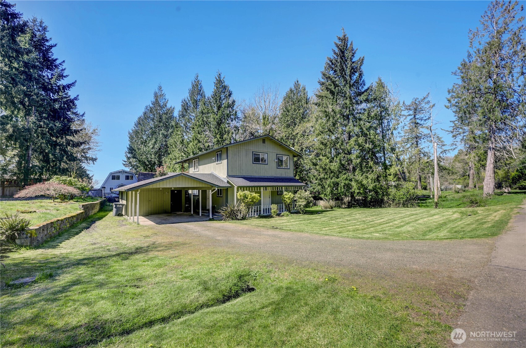 8210 176th Avenue Southwest Longbranch, WA 98351 - Photo 23 of 28 a house with trees in front of it