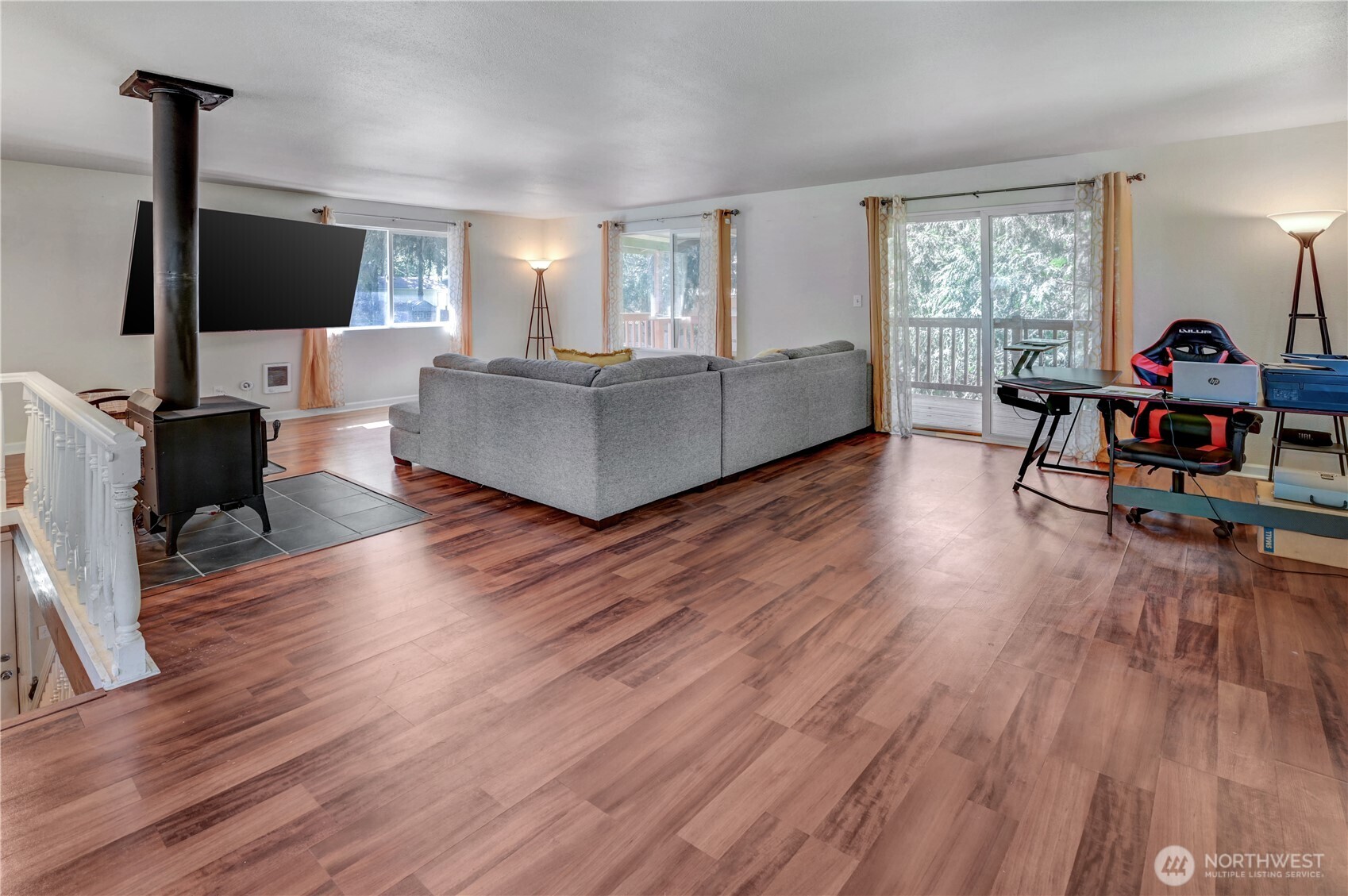 8210 176th Avenue Southwest Longbranch, WA 98351 - Photo 7 of 28 a living room with furniture and a flat screen tv