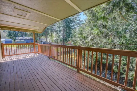 a view of a balcony with wooden floor