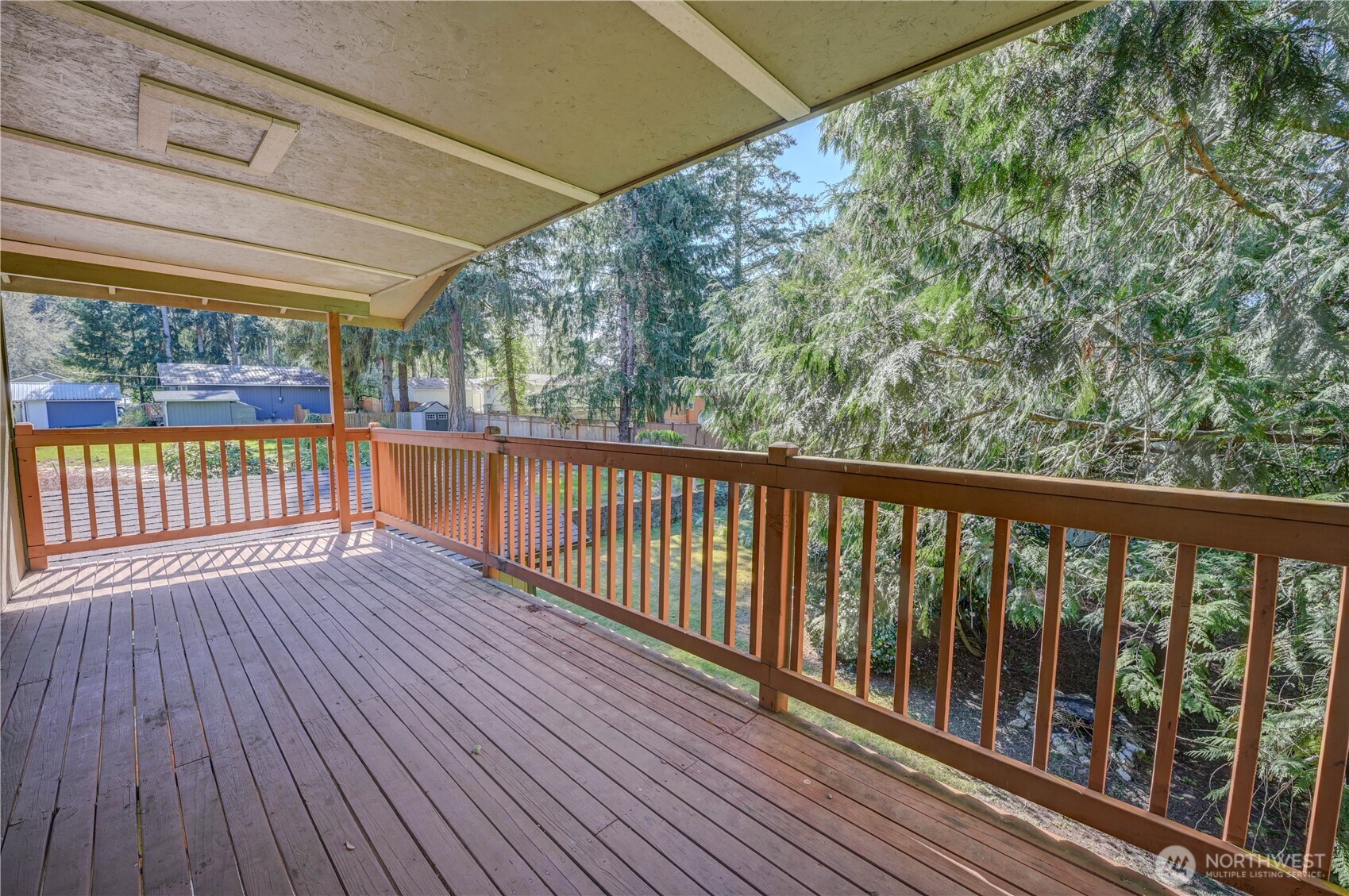 8210 176th Avenue Southwest Longbranch, WA 98351 - Photo 10 of 28 a view of a balcony with wooden floor