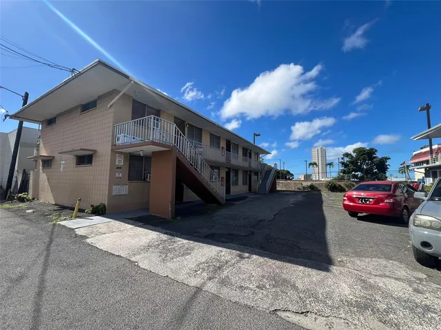 a view of a car park in front of house