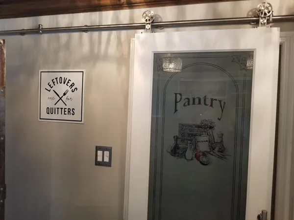 a bedroom with a bed and a mirror