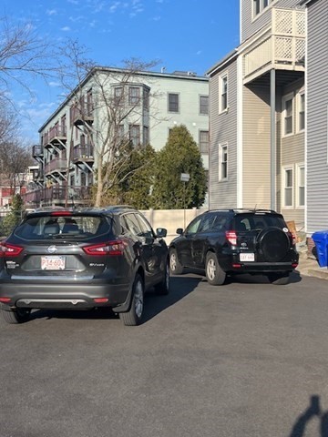203 High Street Brookline, MA 02445 - Photo 17 of 18 a view of a cars park in front of a building