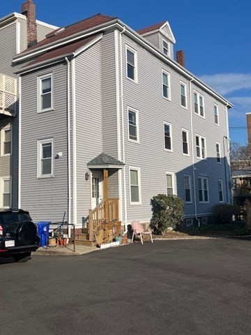 203 High Street Brookline, MA 02445 - Photo 18 of 18 a front view of a house with a yard