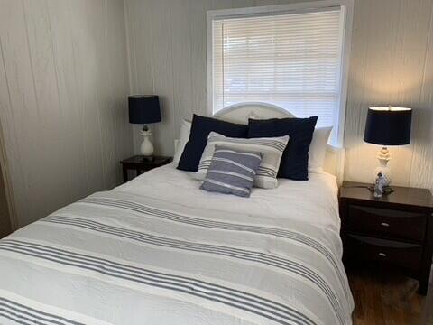 2323 25th Street, Unit REAR Lubbock, TX 79411 - Photo 5 of 8 a bedroom with a bed and a window