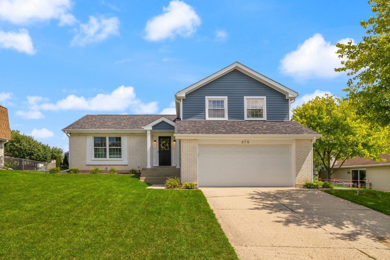 375 Partridge Court Algonquin, IL 60102 - Photo 1 of 27 a front view of house with yard and green space