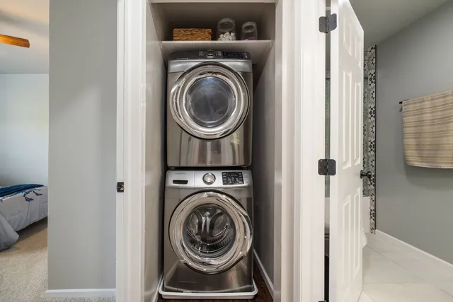 a view of storage and utility room with washer and dryer