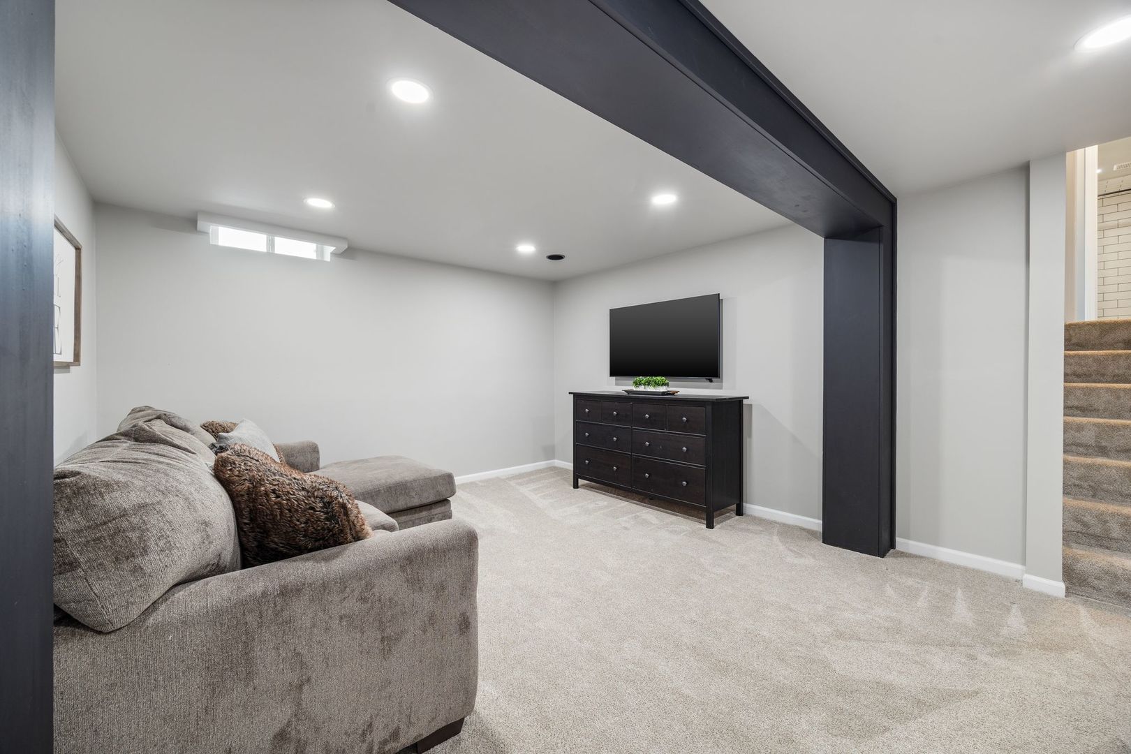 375 Partridge Court Algonquin, IL 60102 - Photo 22 of 27 a living room with furniture and a flat screen tv